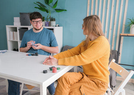 couple playing poker at home, playing games, hobbies and leisure