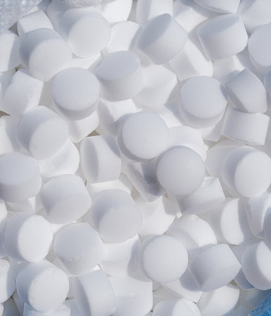 top view of industrial salt pills for pool cleaning. Salt water cleaning pool system
