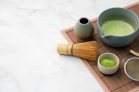 making green matcha tea during the Japanese ceremony. Traditional kit, Bamboo whiskey and beverage...
