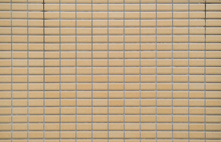 Brick wall with orange and yellow brick.の写真素材