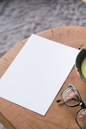 blank paper sheet mockup on wooden coffee table with green matcha tea and glasses, asian style