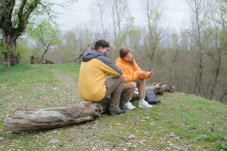 young couple in love enjoying the beautiful nature in the forest in early springの写真素材