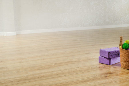 Yoga blocks, massage balls on the floor with copy spaceの写真素材