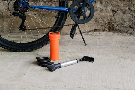 Tools, instrument for repairing bike on the outdoor background near bicycle wheel. Bicycle repair.の写真素材