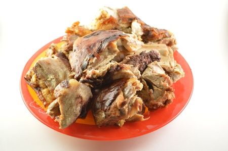 Roast pork on the plate isolated on white の写真素材