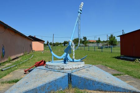 Old anchor. Marina in background.の写真素材