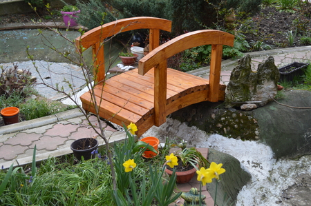 Miniature bridge and footpath with river belowの写真素材