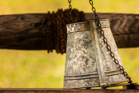 Vintage metal bucket, old wellの写真素材