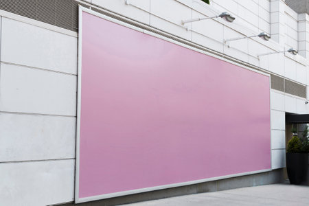Blank pink billboard in front of a shopping mall, side viewの写真素材