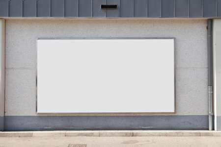 Large blank billboard on a street wall, banners with room to add your own textの写真素材