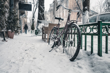Bicycles on a snowy street in the city. winter season.の写真素材