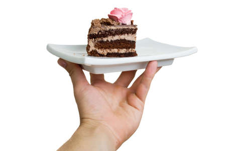hand with the cake on a plate. isolated on white