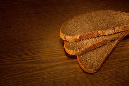 Sliced bread on wooden backgroundの写真素材