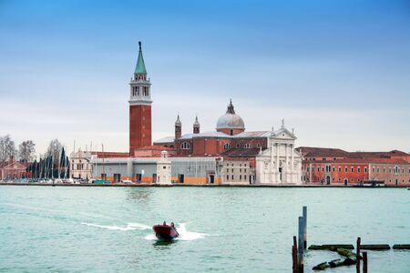Fast boat in front of San Giorgio Maggiore Island, Venice, italyの写真素材
