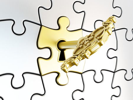 Golden key on the puzzle part の写真素材