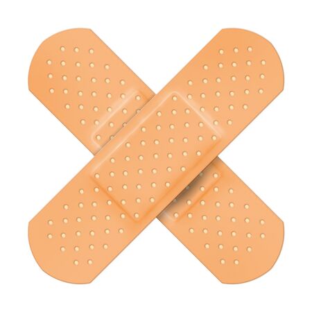 Adhesive plaster cross shape isolated on white background.の写真素材