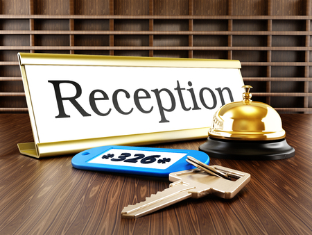 Hotel reception placard, service bell and room keysの写真素材