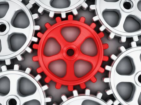 Red gear part standing out from gray gearsの写真素材