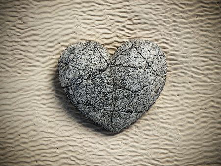 Stone heart standing on beach sand. 3D illustrationの写真素材