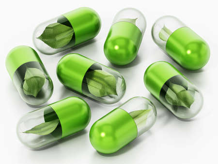 Green leaves inside capsule pills. 3D illustration.の写真素材