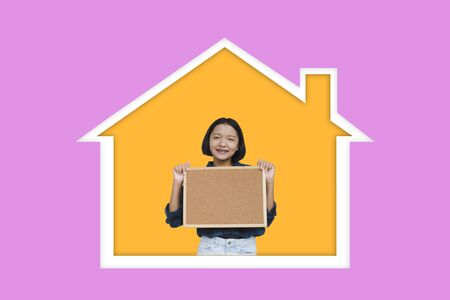 Happy asia girl enjoy life at home with purple background.の写真素材