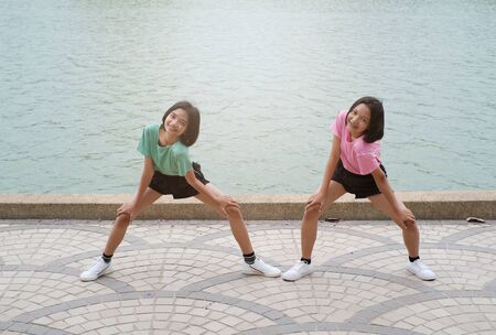 Young Asian girl exercise at health park.の写真素材