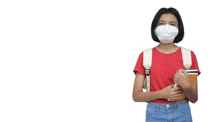 Asia girl wearing mask and hold book.WHite background.の写真素材