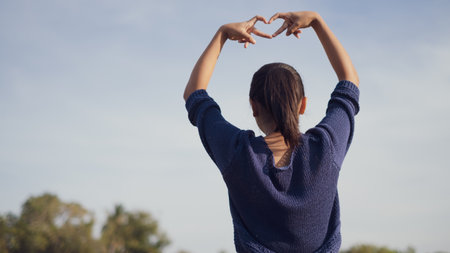 Happy Young girl with blue sky .の写真素材