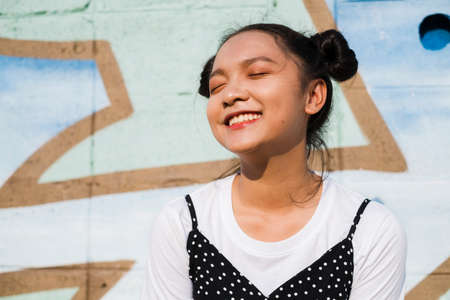 Portrait young girl with a colorful background, Asian girl, Happy girl.の写真素材
