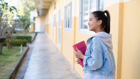 School girl standing at school,young girl.の写真素材