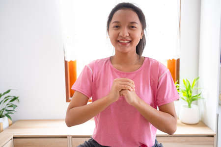 Young girl workout excercise at home in living room,Asian girl.の写真素材