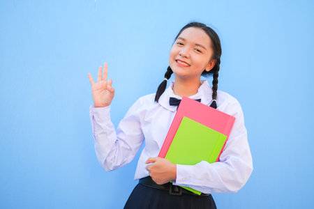 Happy school with book on blue background.の写真素材