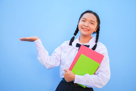 Happy school with book on blue background.の写真素材