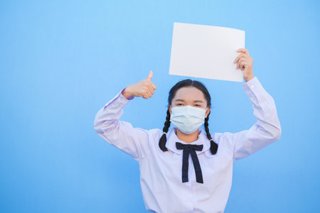 School girl show billboard on blue background.の写真素材