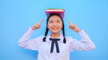 Happy school with book on blue background.の写真素材