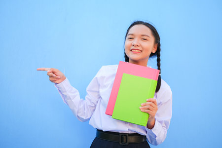 Happy school with book on blue background.の写真素材