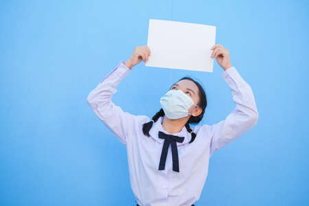 School girl show billboard on blue background.の写真素材