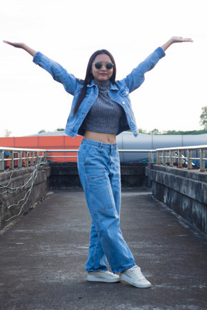Full length body size view of smart girl and cheerful girl dancing good mood on overpass city background.の写真素材