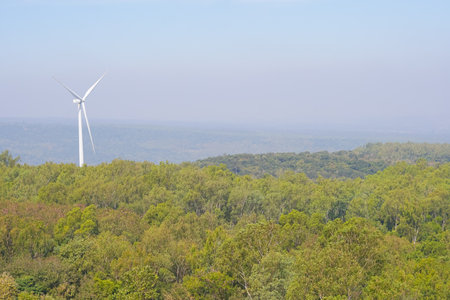Electric wind turbine view with blue sky above the dam. Khao Yai Tieng, Nakhon Ratchasima provinces, Thailandの写真素材