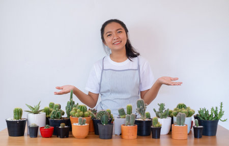 Happy smiling girl with cactus.の写真素材