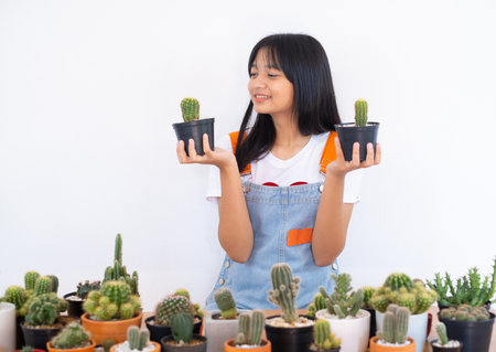 Happy smiling girl with cactus.の写真素材