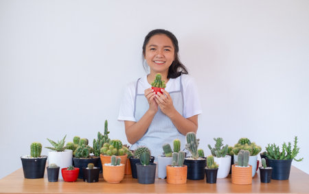 Happy smiling girl with cactus.の写真素材