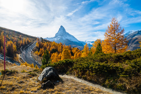 Railroads and beautiful autumn foliage and Mt. Matterhorn famous Alps at Zermatt Switzerland.の写真素材