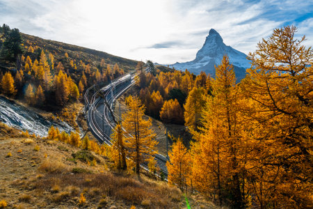 Railroads and beautiful autumn foliage and Mt. Matterhorn famous Alps at Zermatt Switzerland.の写真素材