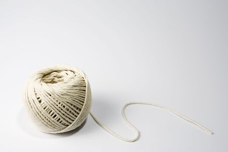 A ball of string on the lower left-hand side of a white frameの写真素材