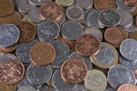A pile of random used UK coinageの写真素材