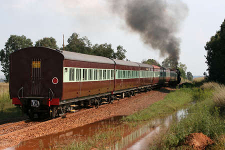 Steam train departing station