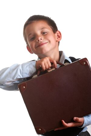 Young boy in elementary/primary school uniform working. Isolated. Copyspaceの写真素材