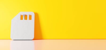 3D rendering of white symbol of memory card   icon leaning on on color wall with floor blurred...
