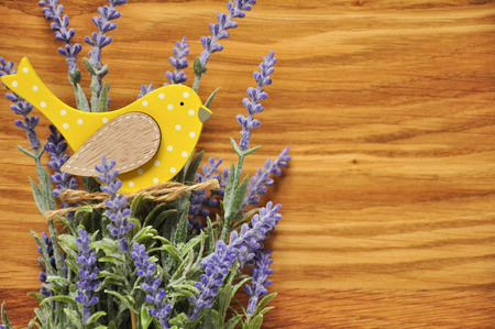 Bouquet of lavender and yellow bird background.の写真素材